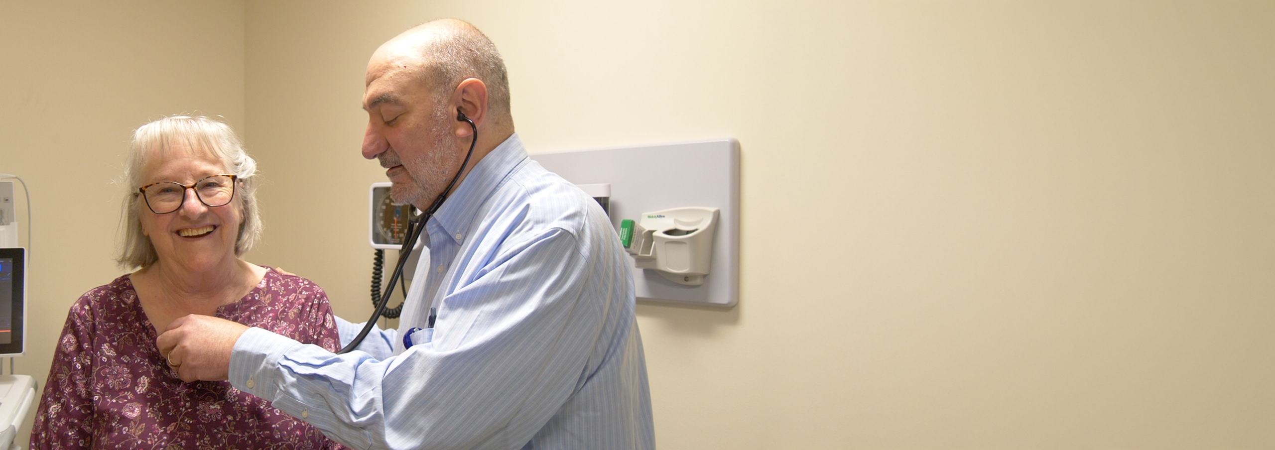 Dr. Steve Anisman checking out patient with stethoscope
