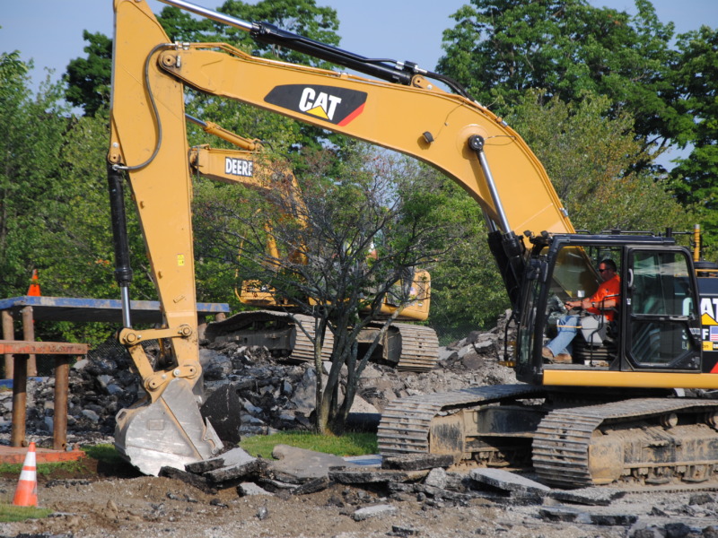 Bucket Loader digging up pavement