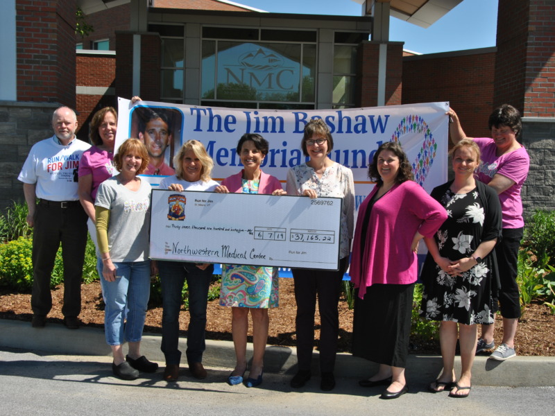NMC Staff presenting a ceremonial check to representatives of the Jim Bashaw Fund
