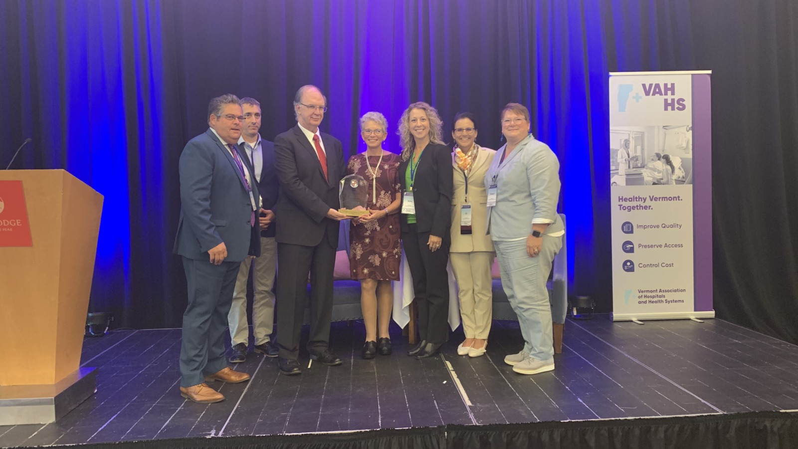 Members of the NMC Board of Directors and Leadership Team accepting an award
