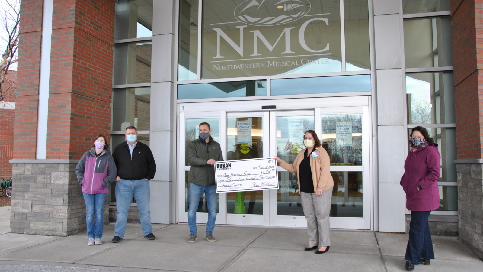 Representatives from Bokan Auto presenting a check for $6,100 to NMC staff, for the Jim Bashaw fund