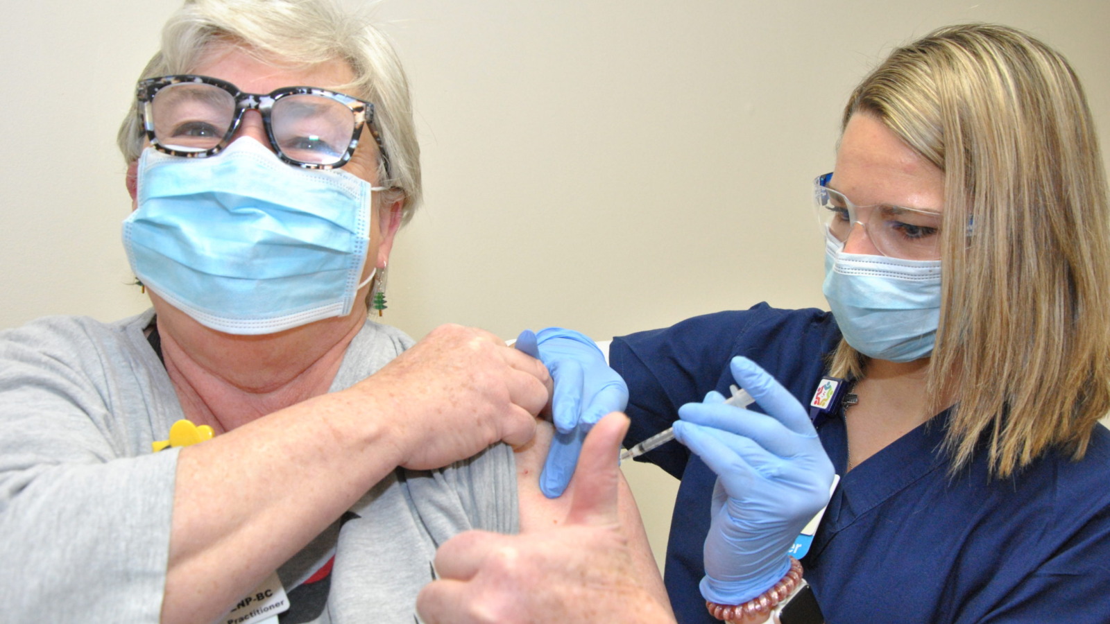 Nurse administering covid-19 vaccination