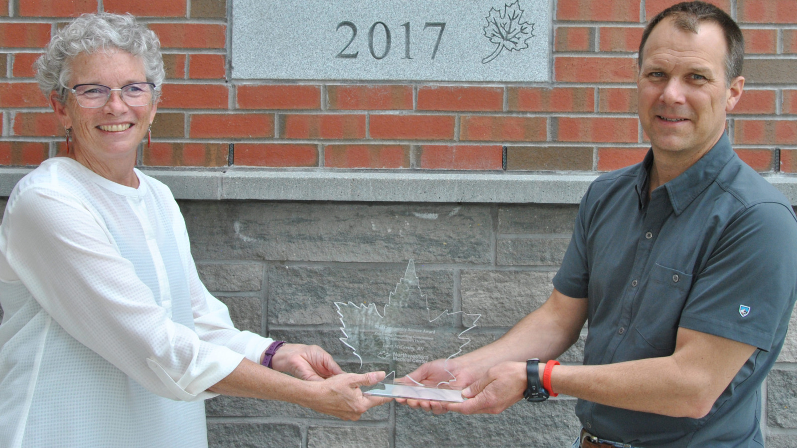 Janet McCarthy receiving NMC's Community Service Award