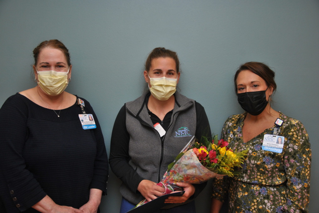 Nurse Chelsea Mulheron being presented with flowers during nurses week