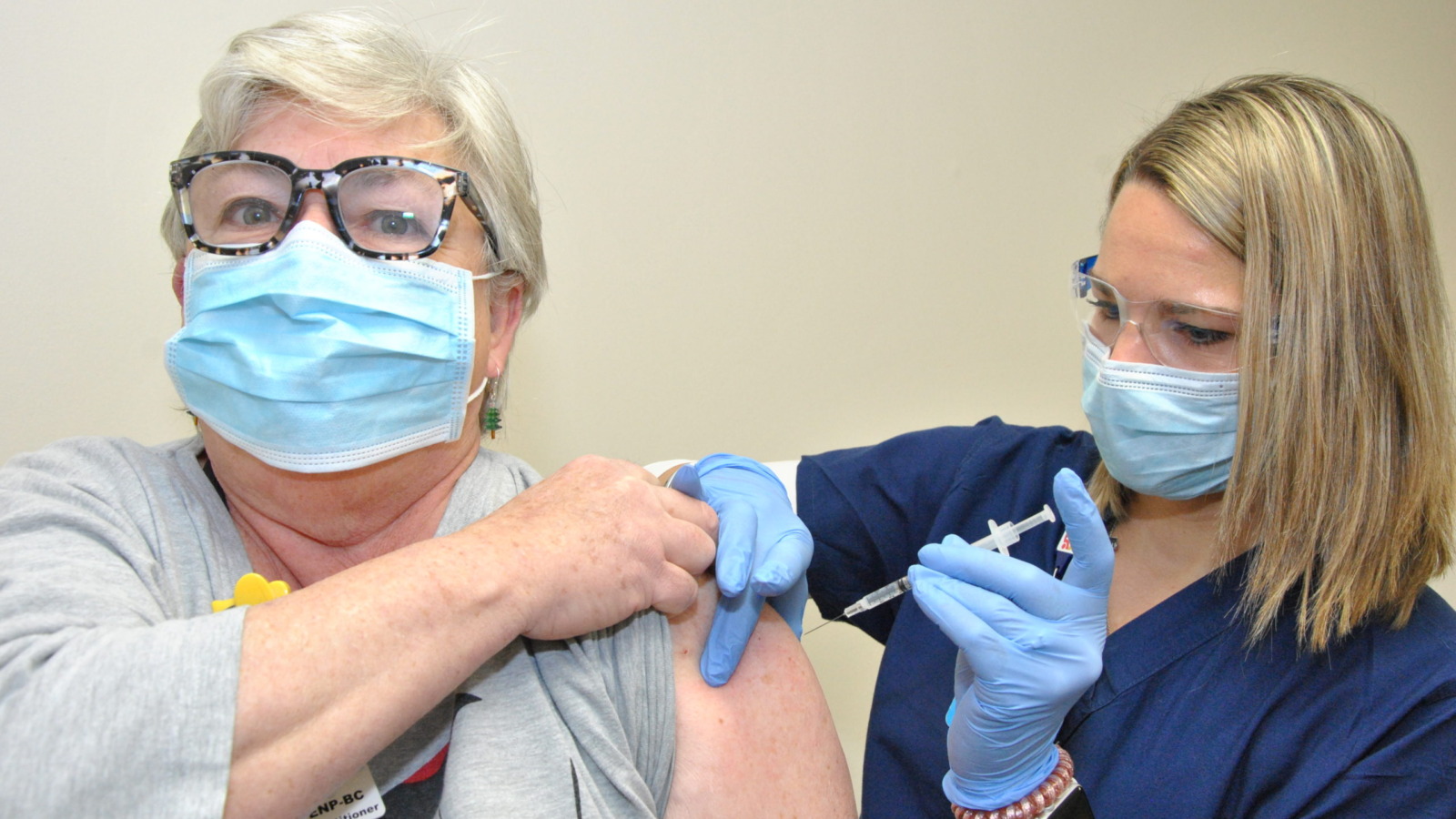 Nurse administering a covid vaccine