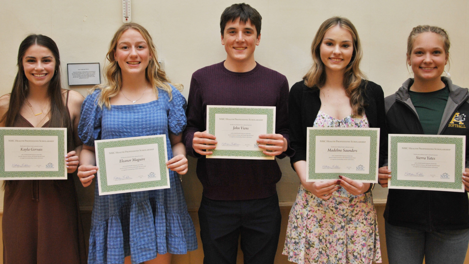 Group of five highschoolers receiving healthcare scholarship awards