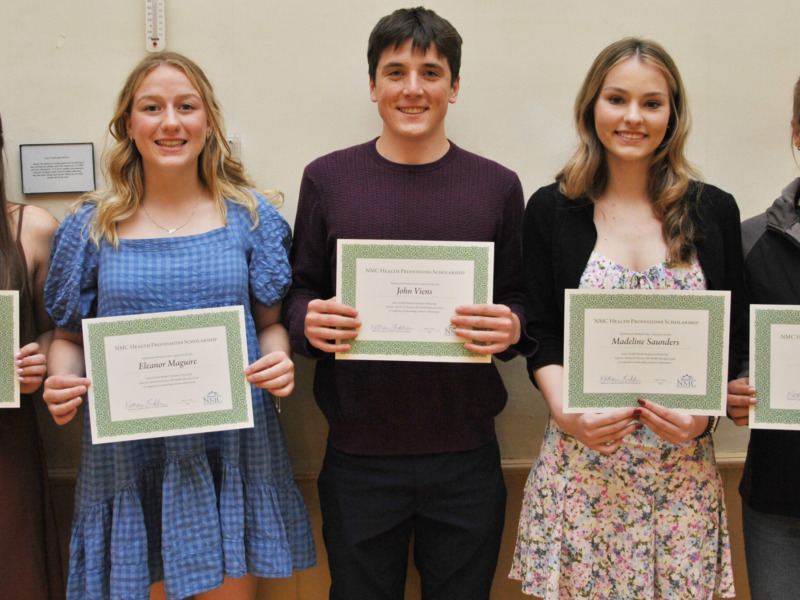 Group of five highschoolers receiving healthcare scholarship awards
