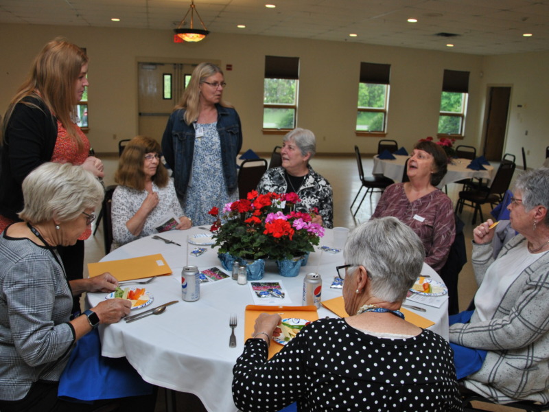 Group of Northwestern Medical Center's volunteers enjoying a snack and conversation
