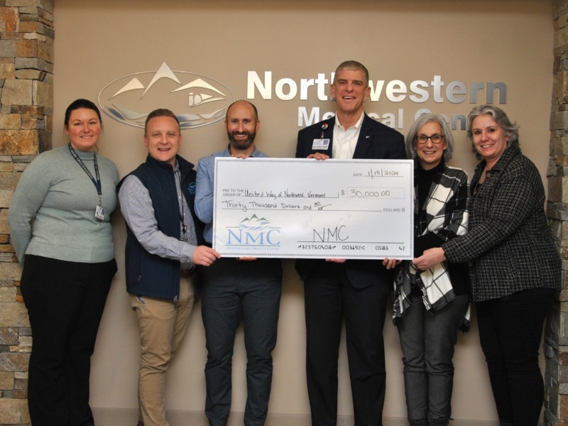 CEO Peter Wright and staff awarding ceremonial check for $30,000 to representatives of the United Way of Vermont
