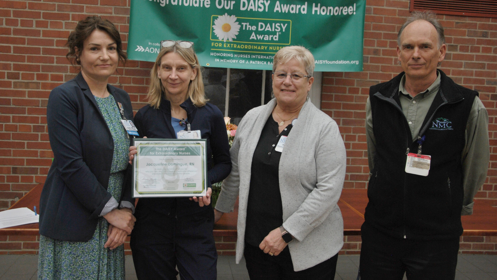 Nurse Jacqueline Domingue accepts the Daisy award