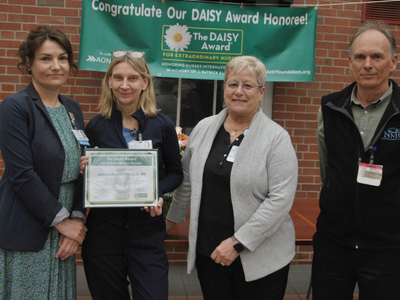 Nurse Jacqueline Domingue accepts the Daisy award