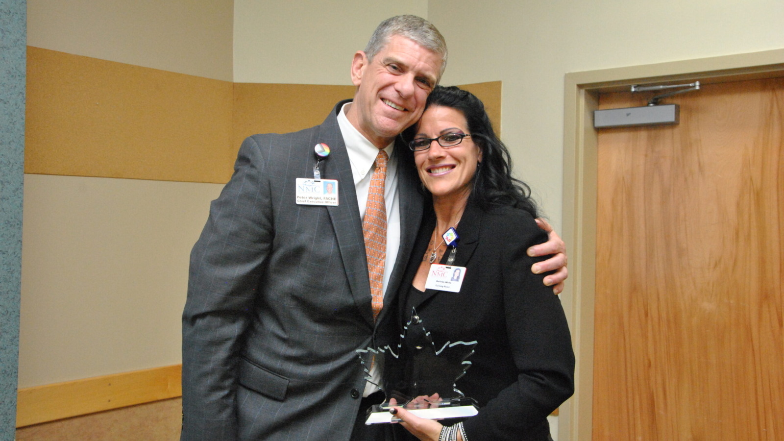 Peter Wright, CEO Northwestern Medical Center presenting NMC's Community Service Award to Melinda White