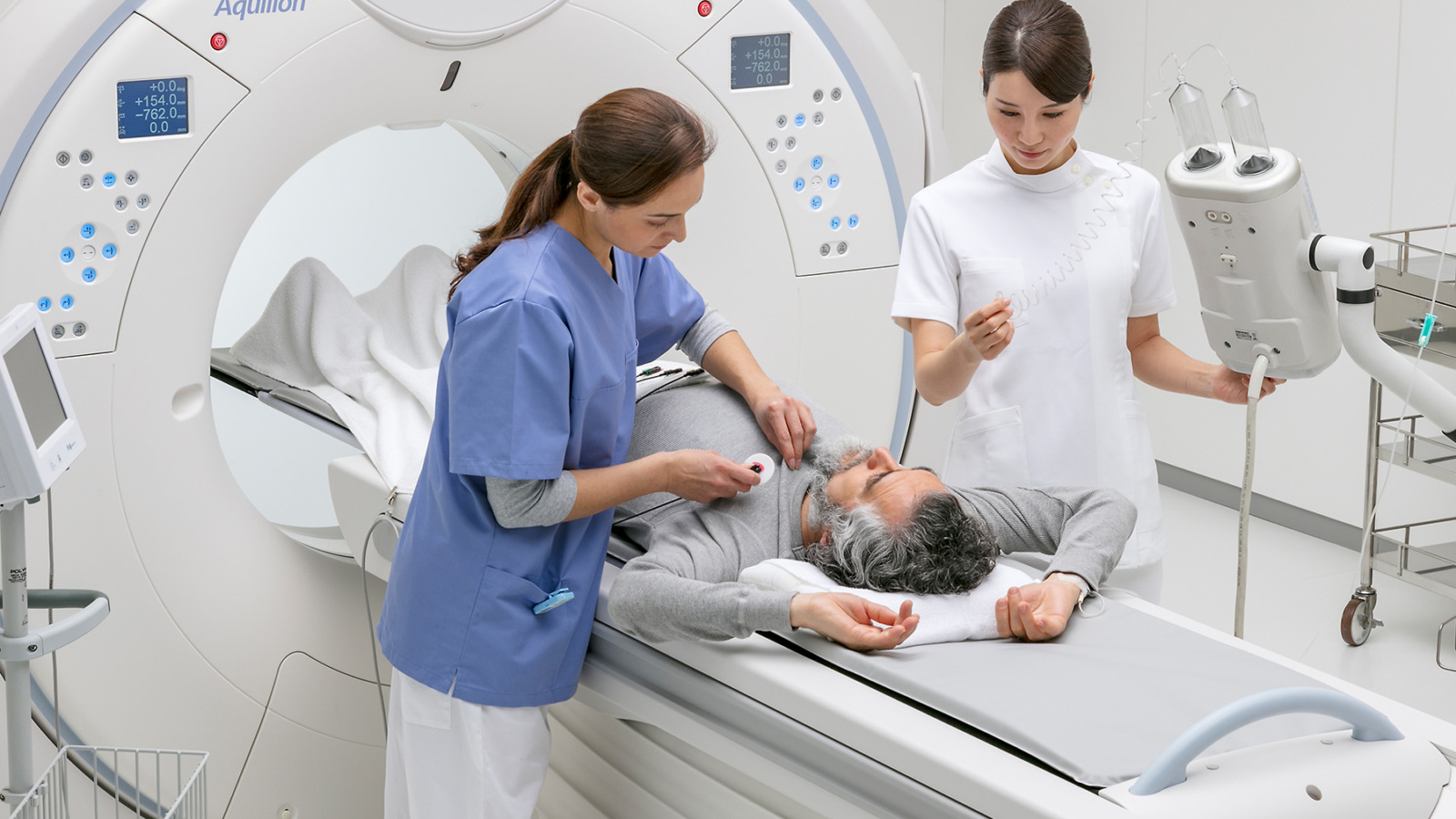 CT technologist preparing a patient for a CT Scan