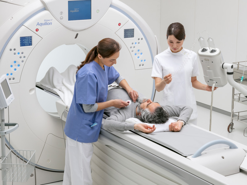 CT technologist preparing a patient for a CT Scan