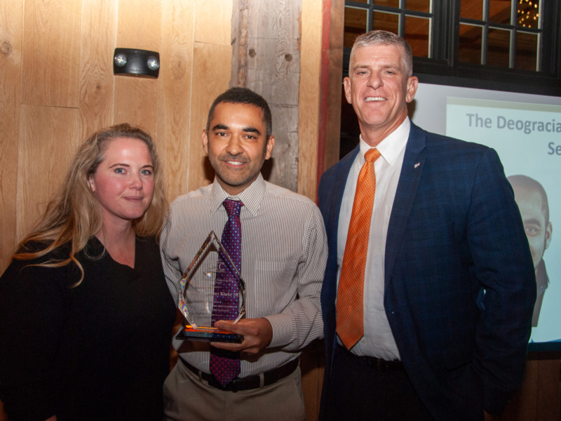 Peter Wright, CEO of Northwestern Medical Center presenting the 2024 Deogracias Esguerra service award to Doctor Donny Khela
