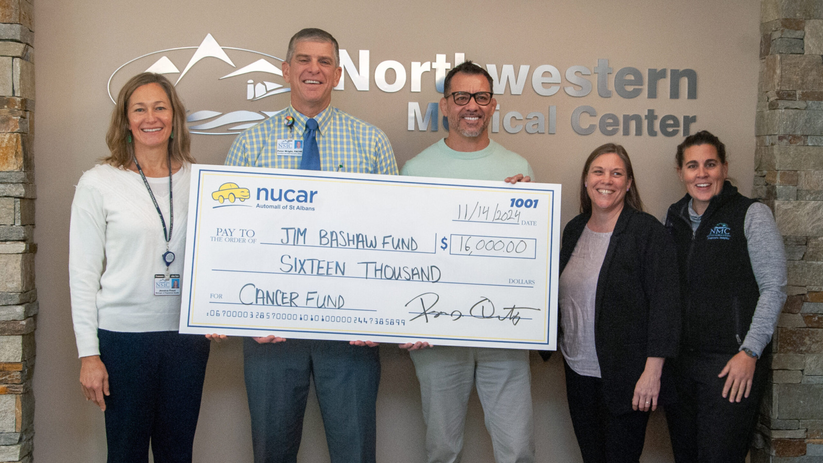 Peter Wright, CEO and other hospital staff presenting a ceremonial check donation to the Jim Bashaw Fund