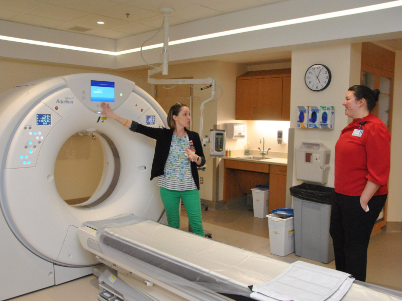 Northwestern Medical Centers lead CAT Scan Technologist Cynthia Bemis demonstrates a new CAT Scan machine to Northwestern's CFO, Stephanie Breault