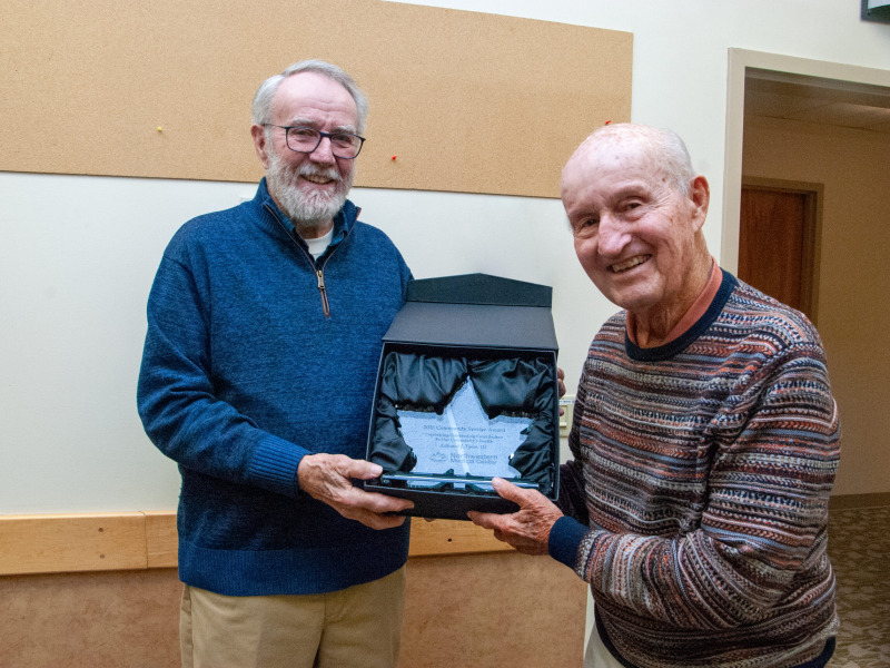Edward J Tyler receives Northwestern Medical Centers 2025 Community Service award from a hospital Board Member