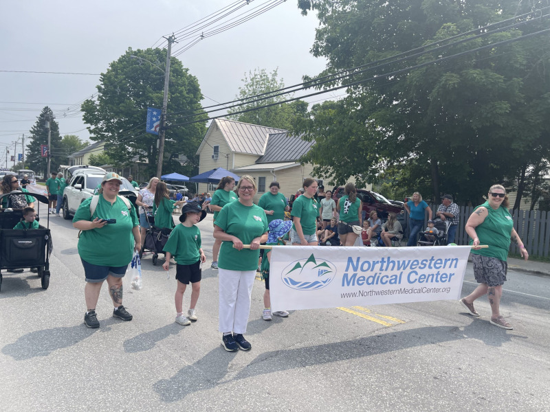 Northwestern Medical Center Group of staff and families walking in a St. Albans city parade