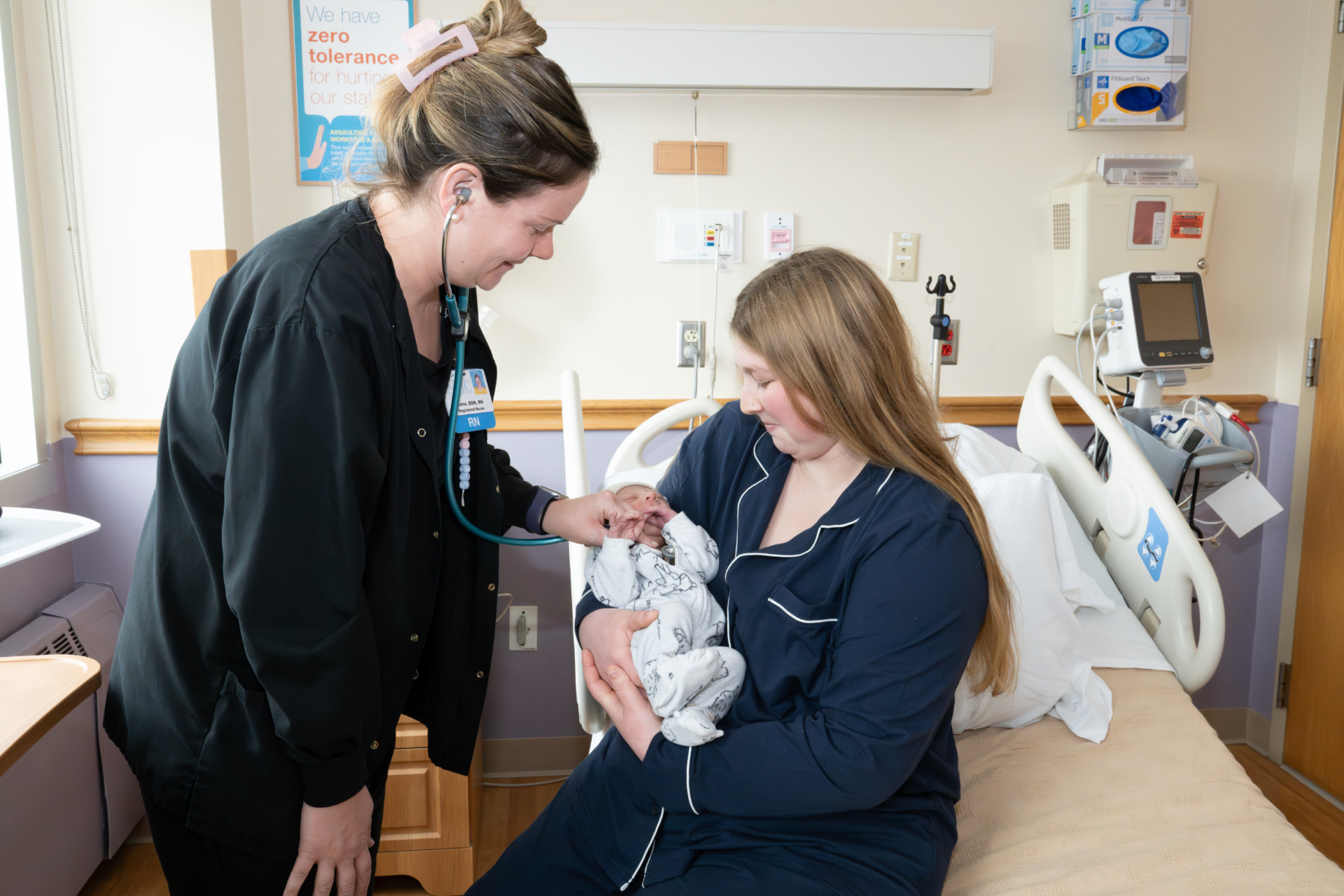 infant being examined by staff on Family Birth Center