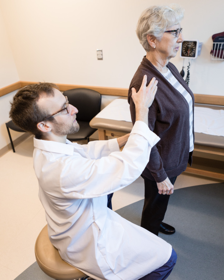 Doctor Nathan Mauser evaluating patient