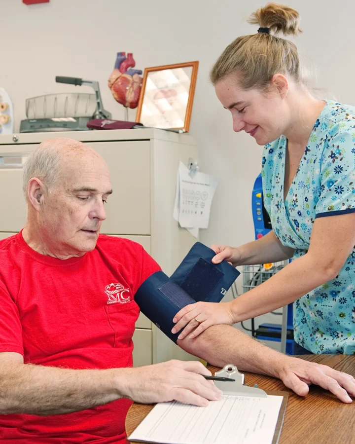 Patient having their blood pressure measured by nurse
