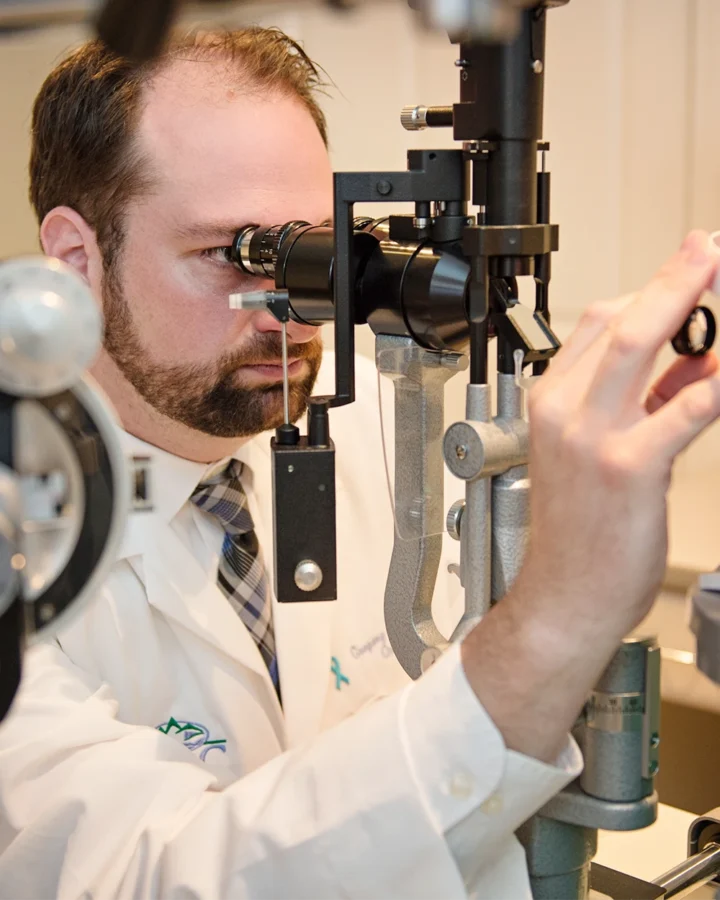 Dr Brophey giving an eye exam of patient