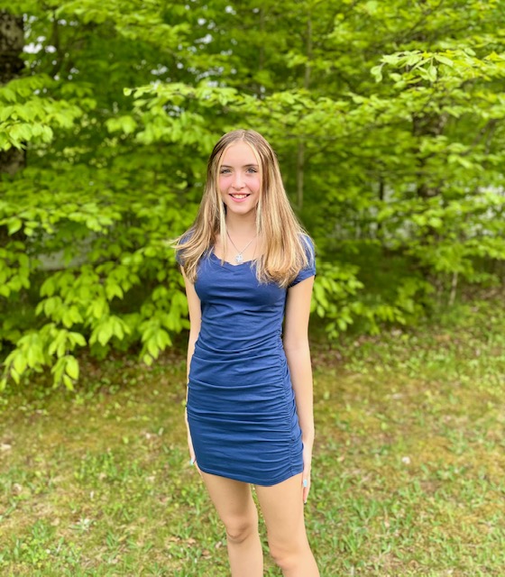Madden GraffBell standing in front of trees smiling
