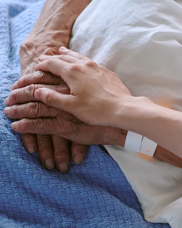 holding hands and providing comfort