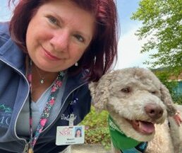 Pet Therapy Volunteer Manon and her dog Charlie outside