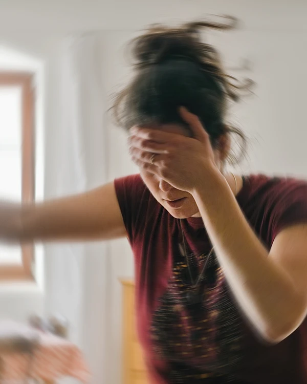 Woman suffering from vertigo