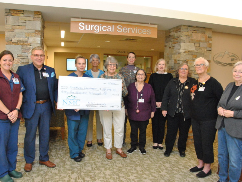 Auxiliary members and hospital staff gathered for check presentation for donation to Anesthesia Department
