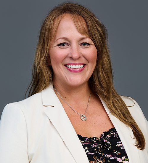 Friendly, professional woman smiling at camera