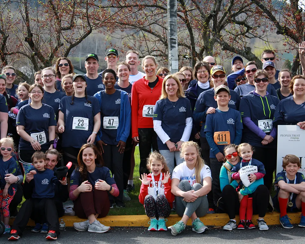 Group of people posing before the Run for Jim event in support of the Jim Bashaw Fund