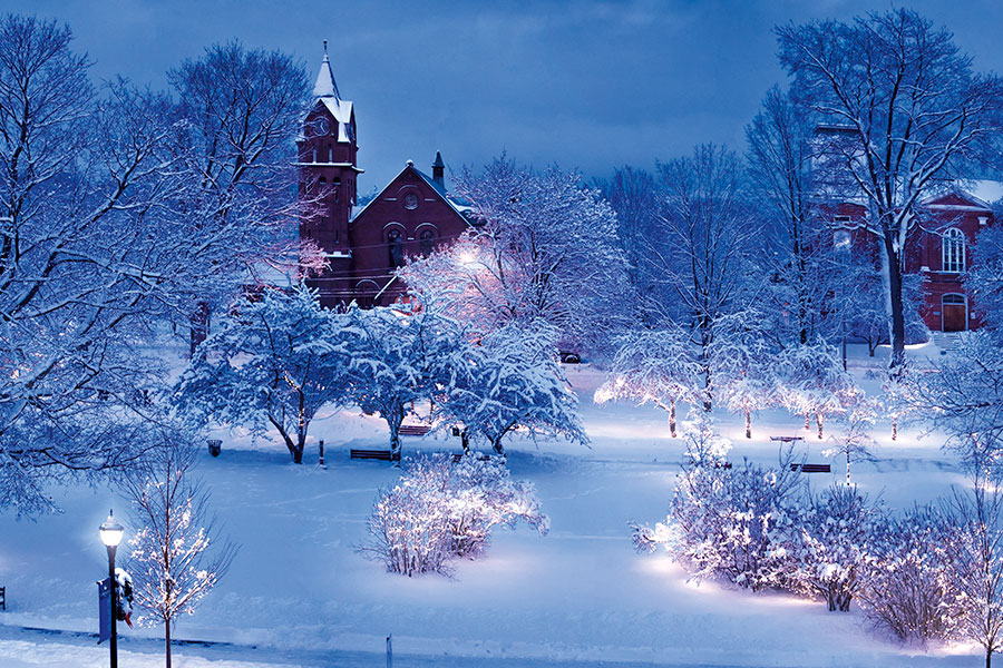 Snowy scene in St. Albans of park and church