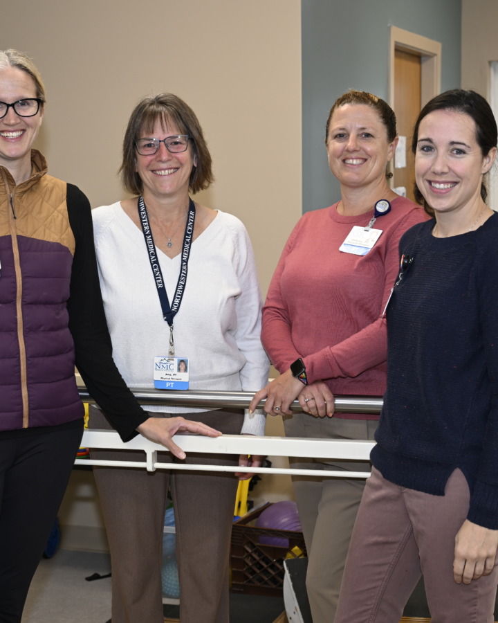 Physical Therapists gathered for group photo in gym