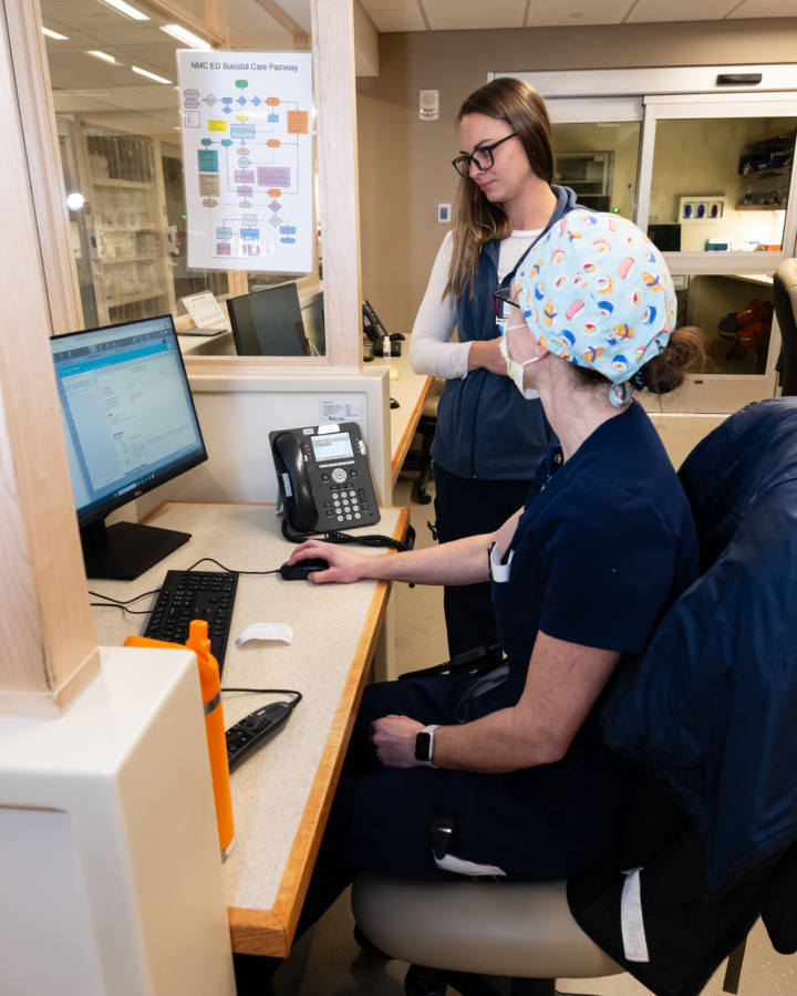 staff having discussion at nursing station