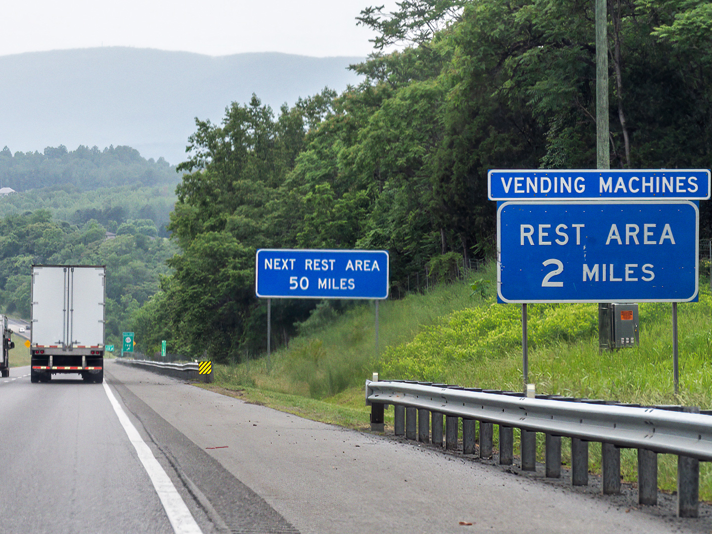 Photo of rest area signs on an interstate