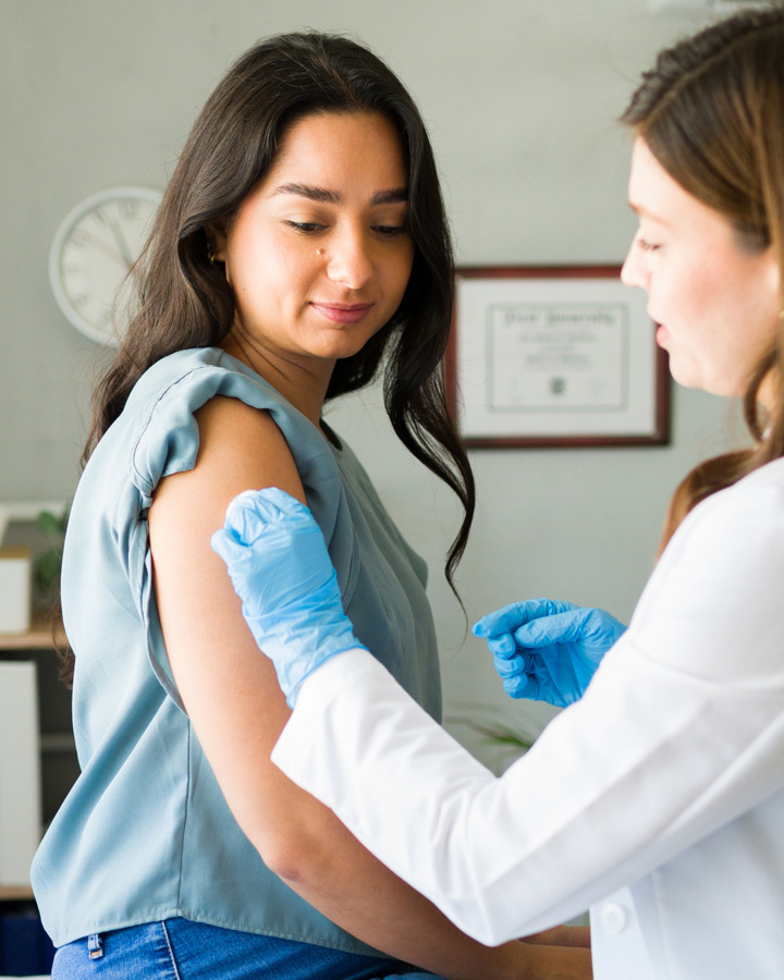 Woman receiving a vaccination