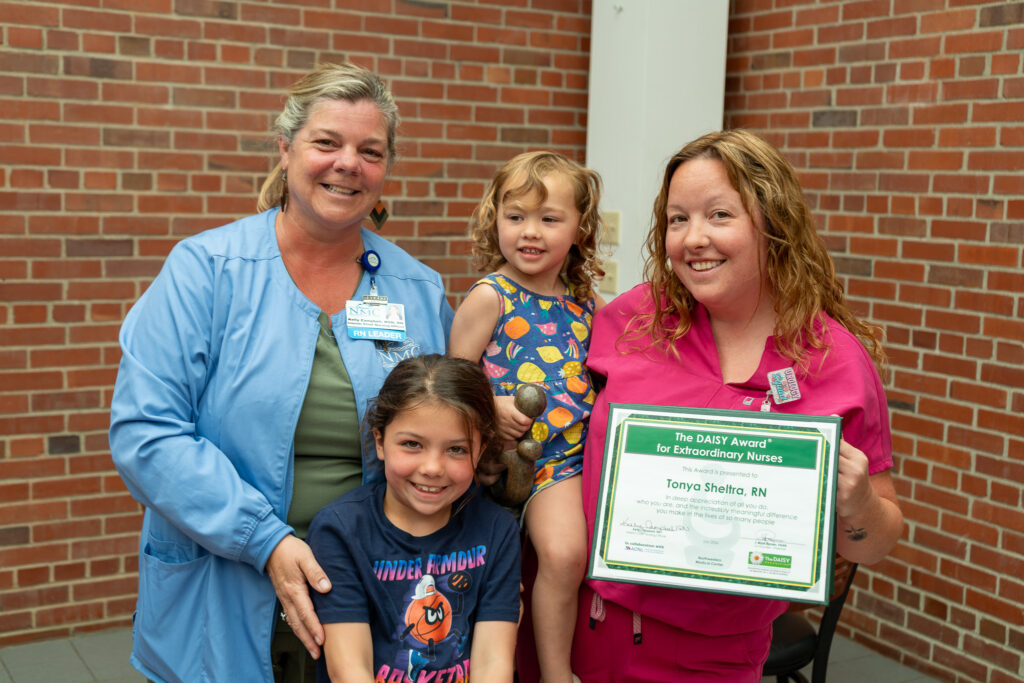 Tonya Sheltra, RN and family after receiving DAISY Award