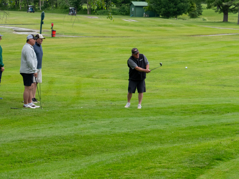 Golfer hitting ball at 2025 annual Community Partners Classic