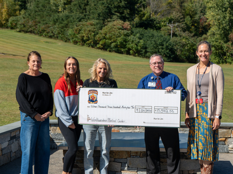 Members from Run for Jim planning, St. Albans Rec Department and Northwestern Medical Center staff gather for check presentation